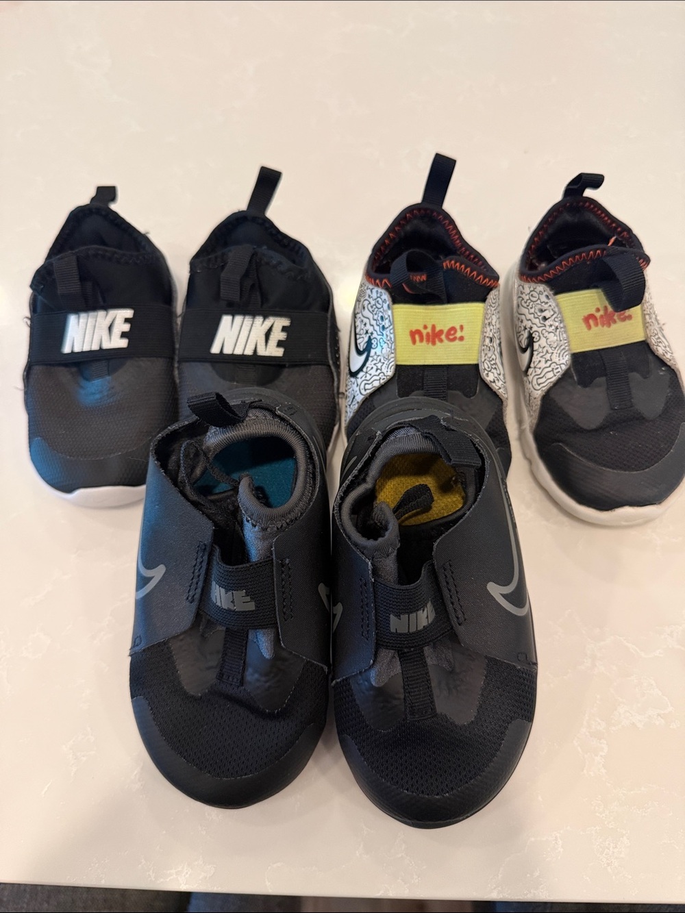 Nike Kids Black Slip-On Sneakers with Yellow Accent
